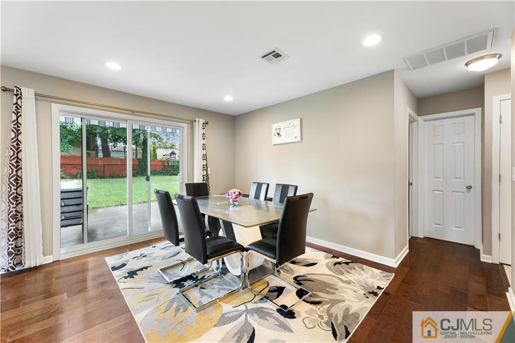 18 Baxter Road Edison, NJ 08817 - Photo 13 of 32 a view of a dining room with furniture wooden floor and a rug