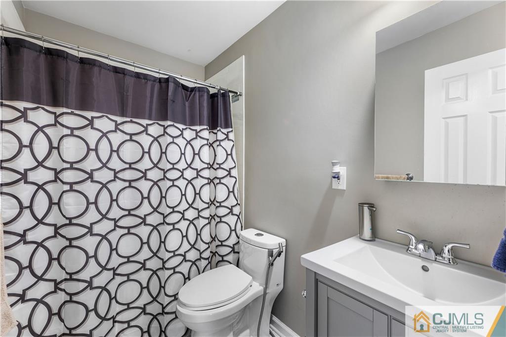 18 Baxter Road Edison, NJ 08817 - Photo 20 of 32 a bathroom with a sink and a toilet