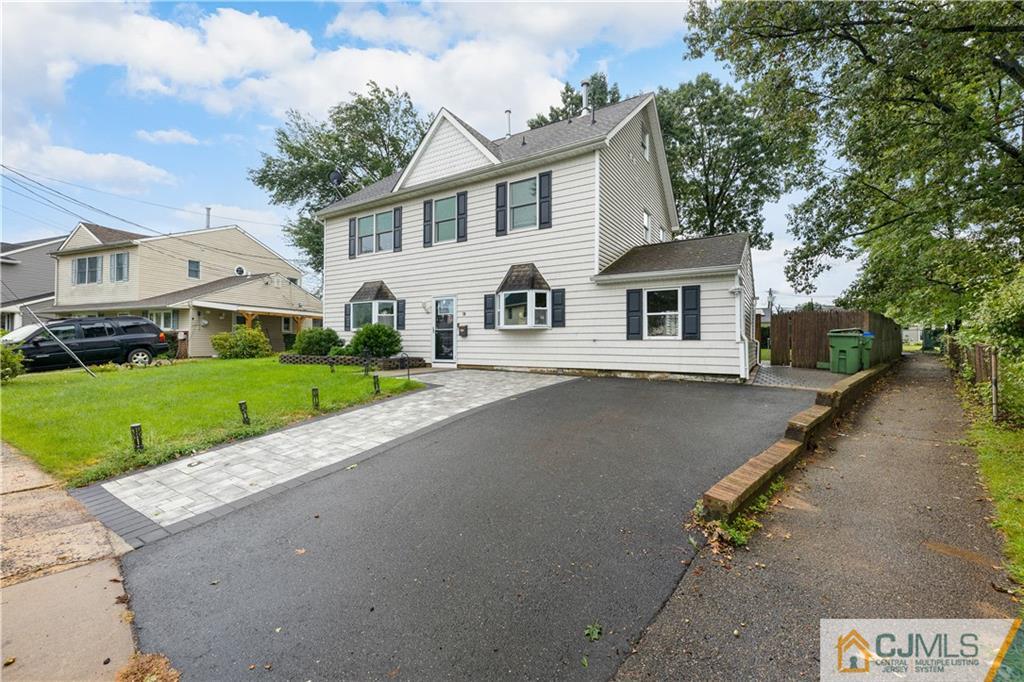 18 Baxter Road Edison, NJ 08817 - Photo 2 of 32 a front view of a house with a yard