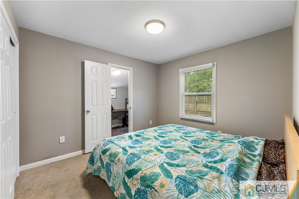 18 Baxter Road Edison, NJ 08817 - Photo 21 of 32 a bedroom with a bed and a window