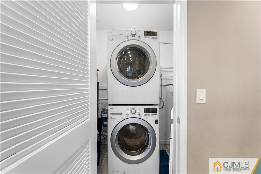 18 Baxter Road Edison, NJ 08817 - Photo 23 of 32 a view of a hallway with washer and dryer