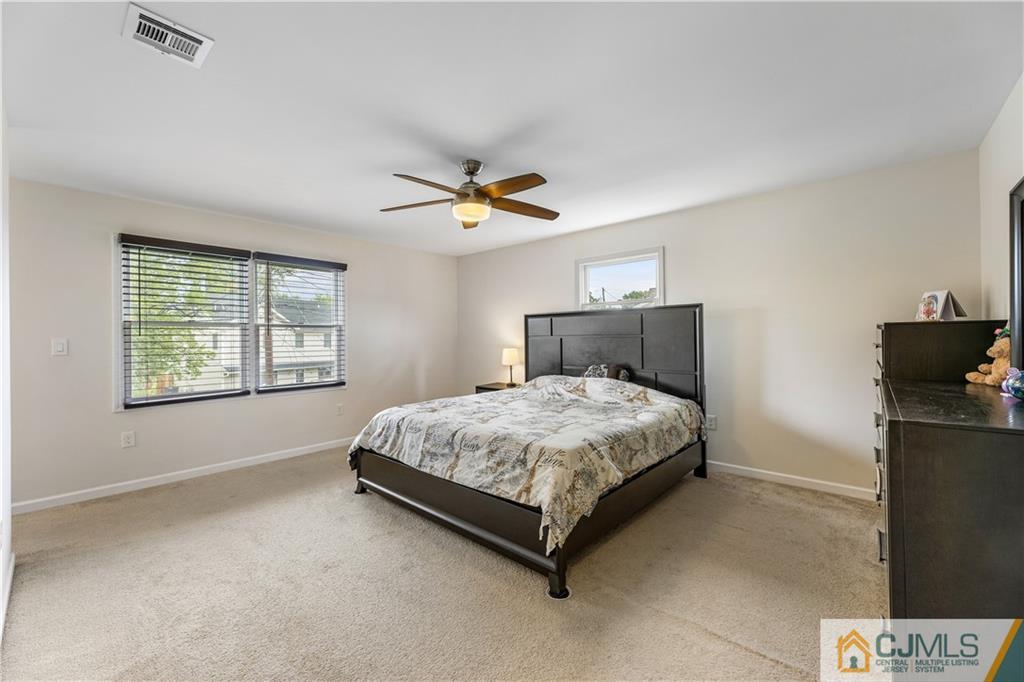 18 Baxter Road Edison, NJ 08817 - Photo 28 of 32 a bedroom with a bed and window