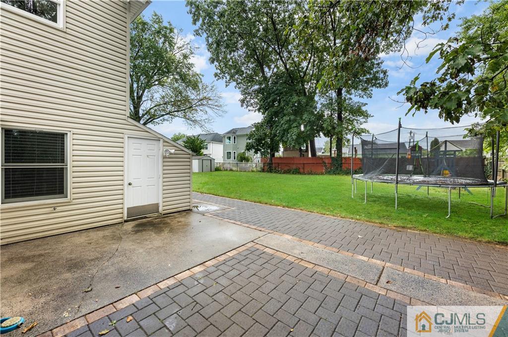 18 Baxter Road Edison, NJ 08817 - Photo 3 of 32 a view of a house with a yard
