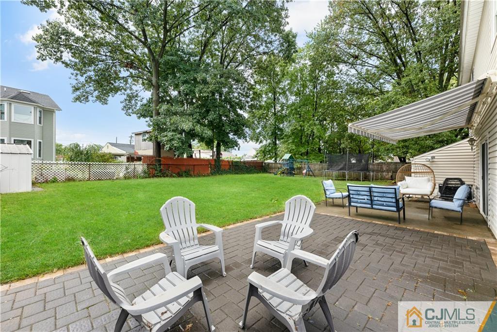18 Baxter Road Edison, NJ 08817 - Photo 8 of 32 a view of a chairs and table in the yard