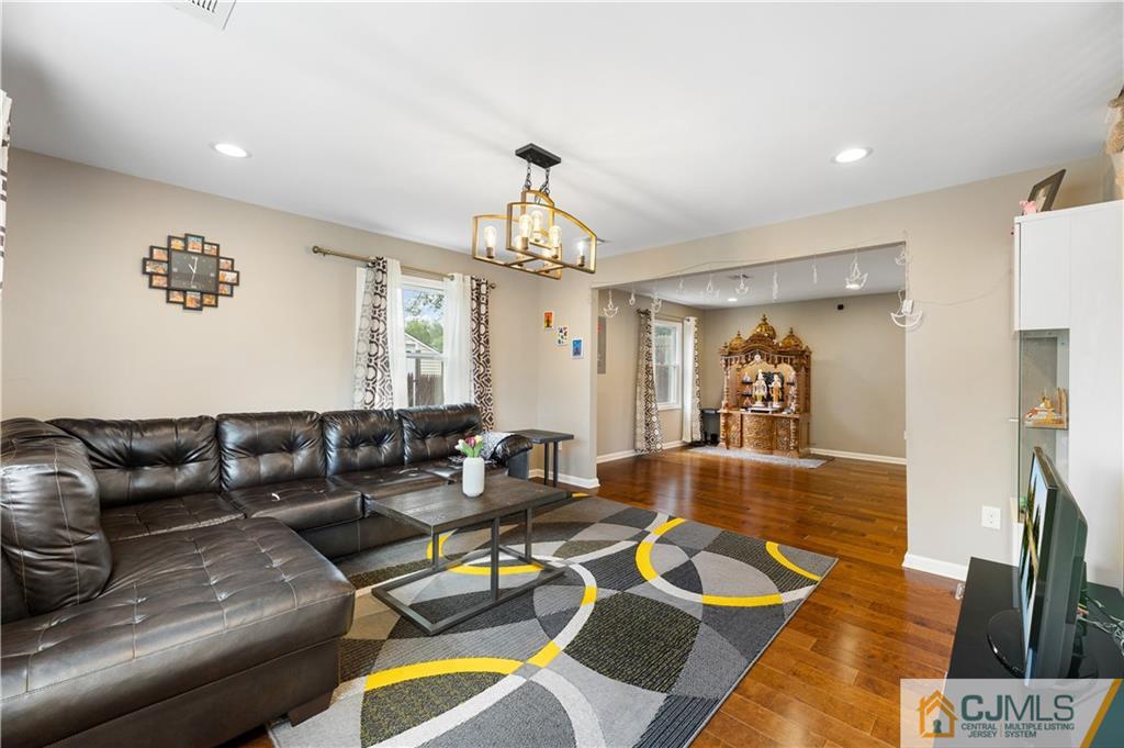 18 Baxter Road Edison, NJ 08817 - Photo 9 of 32 a living room with furniture and wooden floor