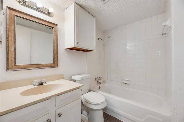 a bathroom with a sink a toilet and a bathtub