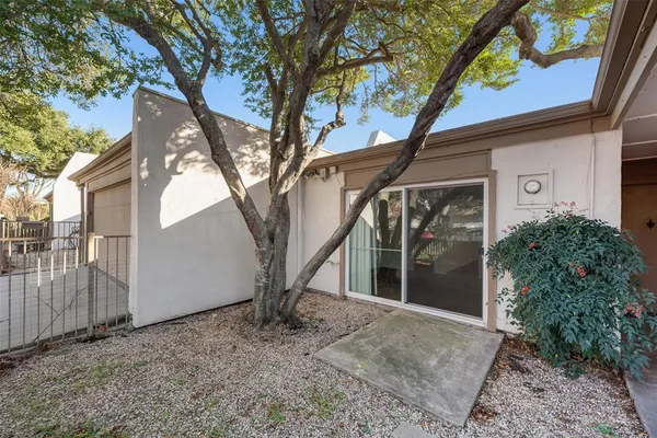 a view of a house with a tree