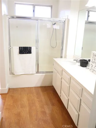 a bathroom with a sink a vanity and a mirror