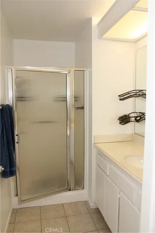 a bathroom with a shower and a sink