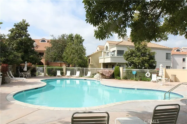 swimming pool view with a outdoor seating