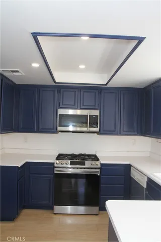 a kitchen with a stove and a microwave