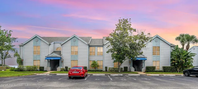 a car parked in front of a house
