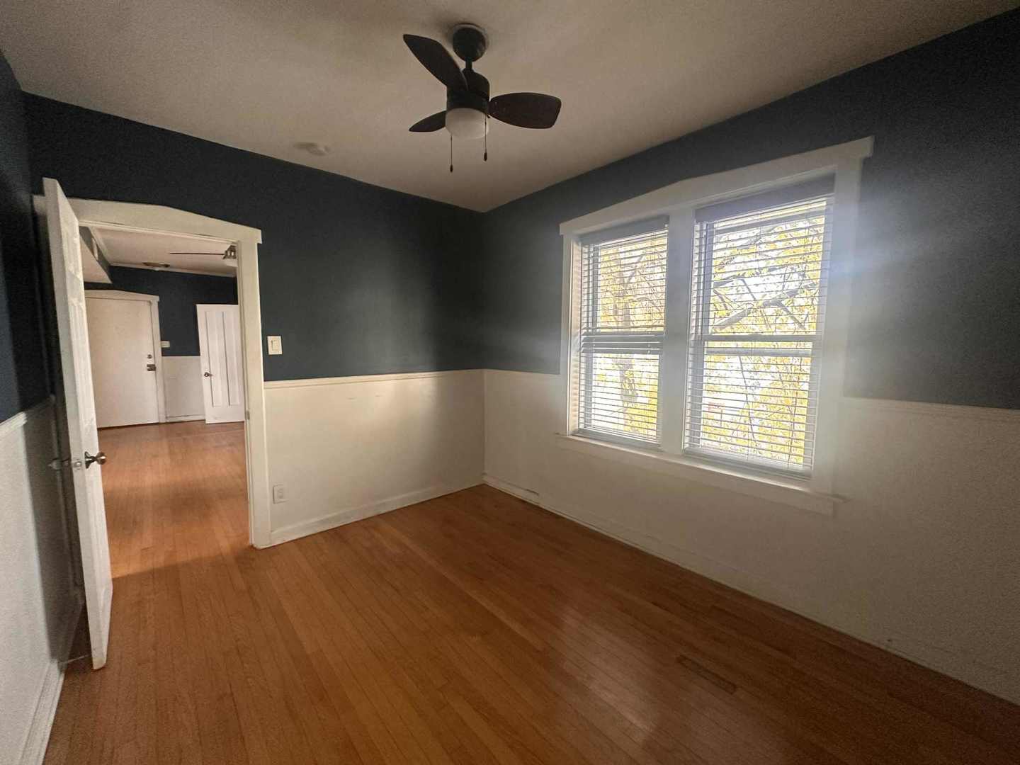 3719 West Hirsch Street, Unit 2 Chicago, IL 60651 - Photo 10 of 13 a view of empty room with wooden floor and fan