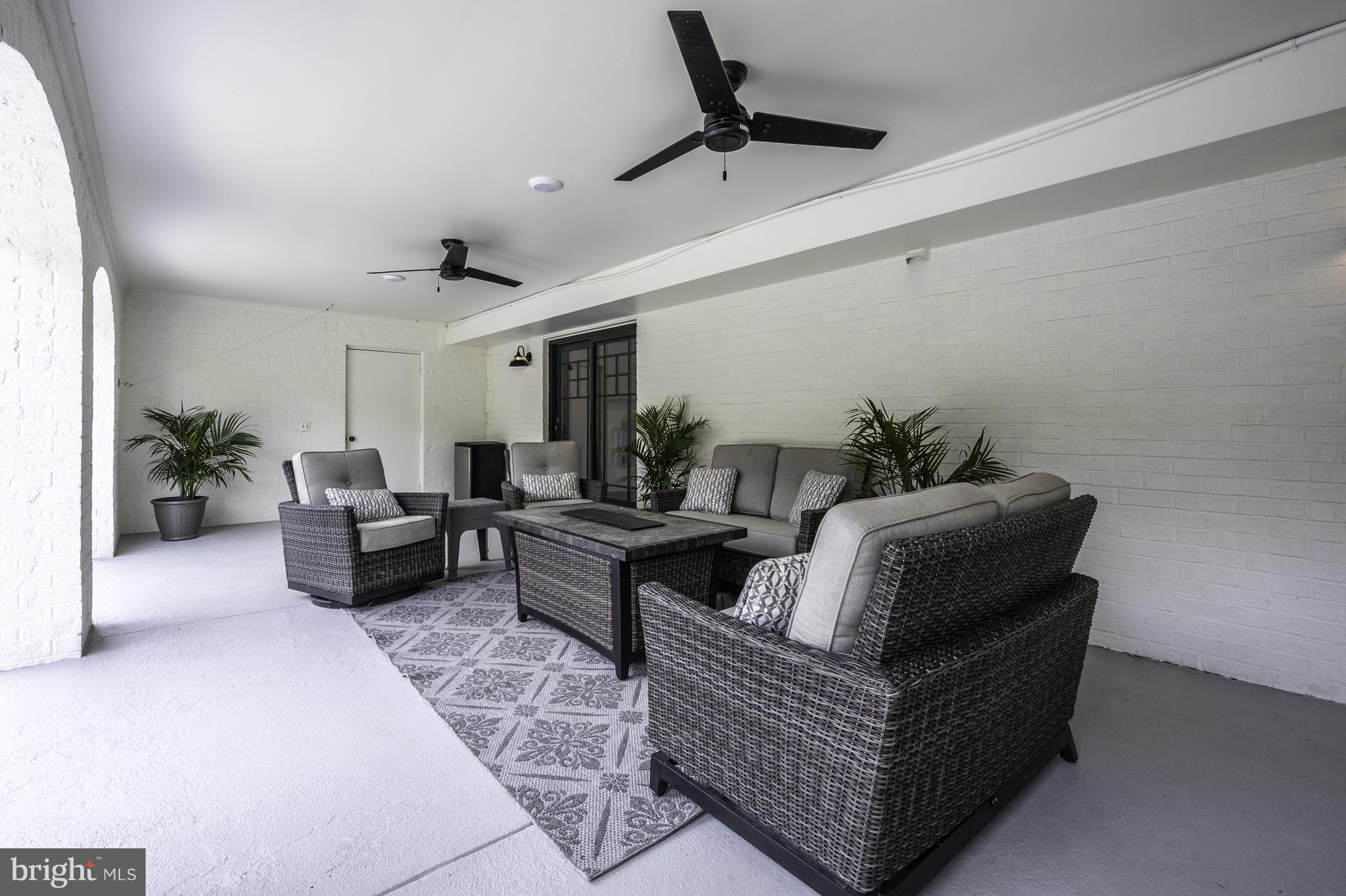 13111 Springdale Estates Road Clifton, VA 20124 - Photo 72 of 109 neutral-toned patio seating area