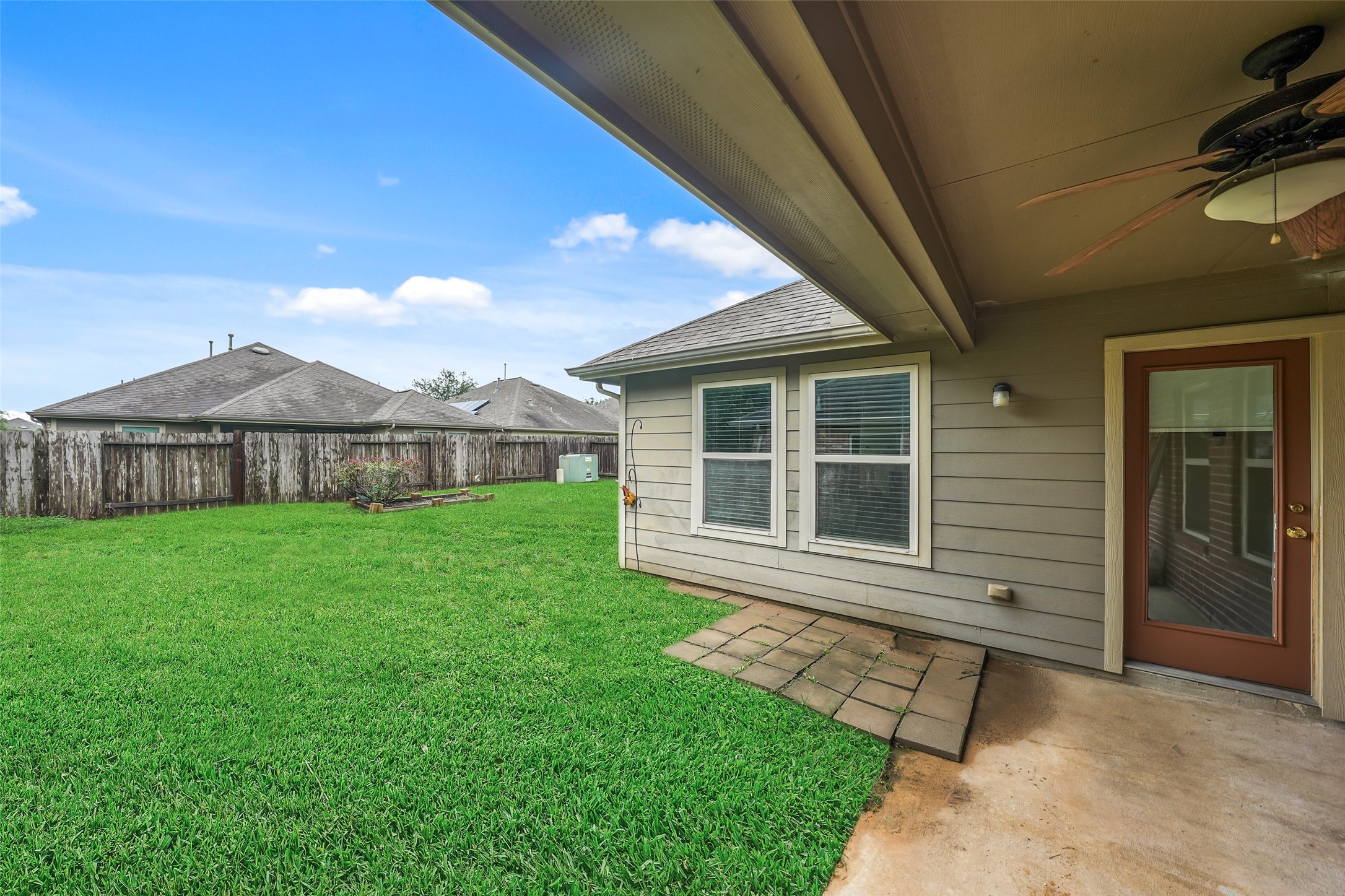 24138 McKinzie Ridge Drive Porter, TX 77365 - Photo 21 of 24 Covered patio with fan. Ready to be enjoyed.