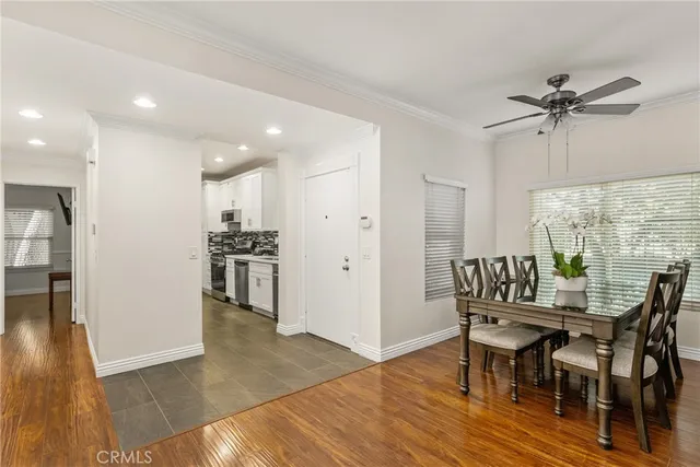a kitchen with stainless steel appliances a sink stove and refrigerator