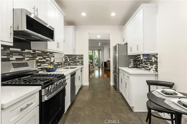 a balcony with table and chairs