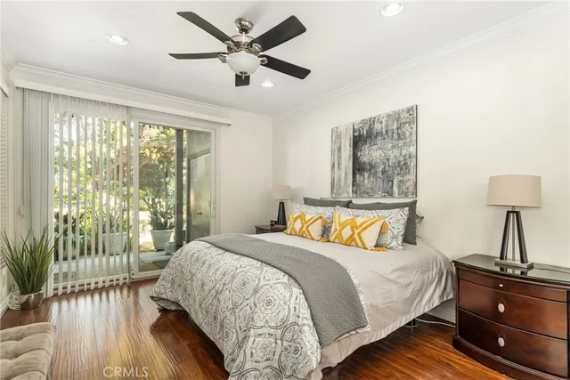 a bedroom with a bed window and couch
