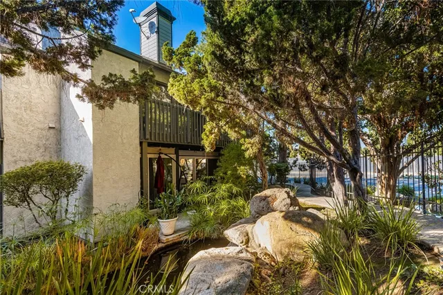 a view of a chairs and table in the garden