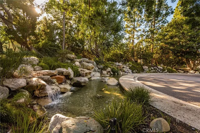 a backyard of a house with yard and outdoor seating