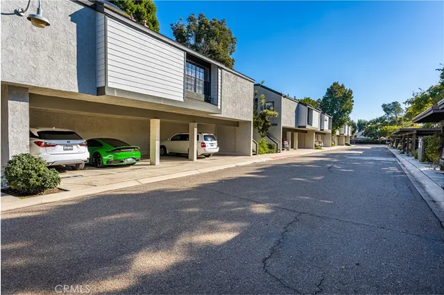 a view of street with parked cars
