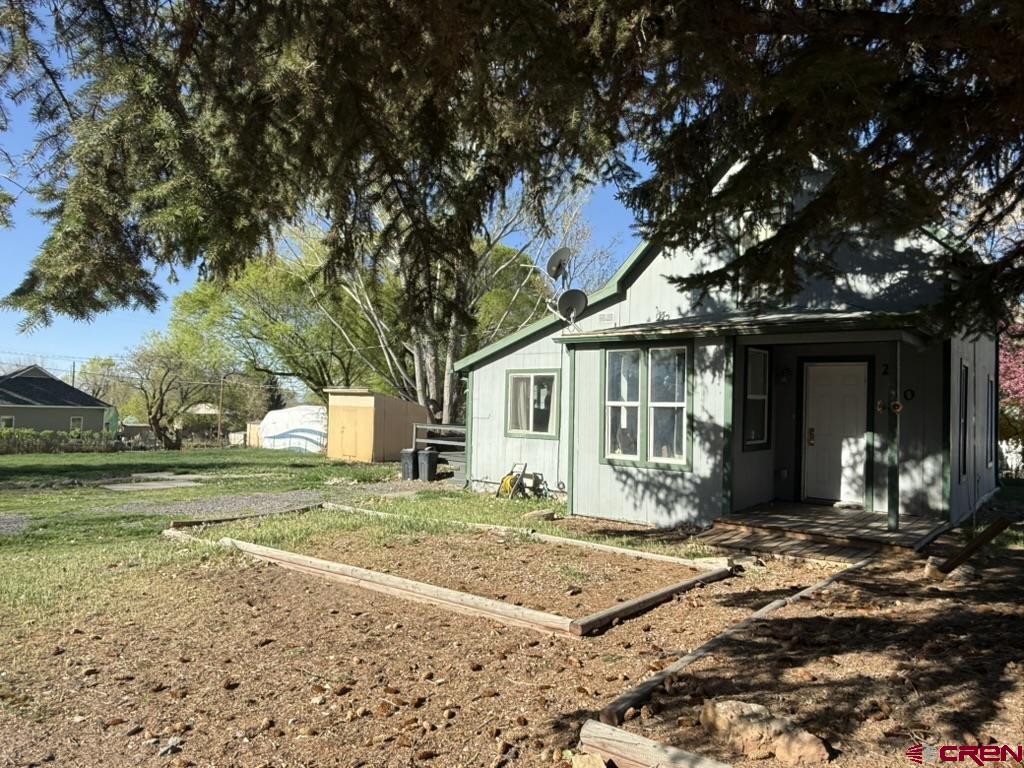 210 Southwest 6th Street Cedaredge, CO 81413 - Photo 15 of 16 a front view of a house with a garden