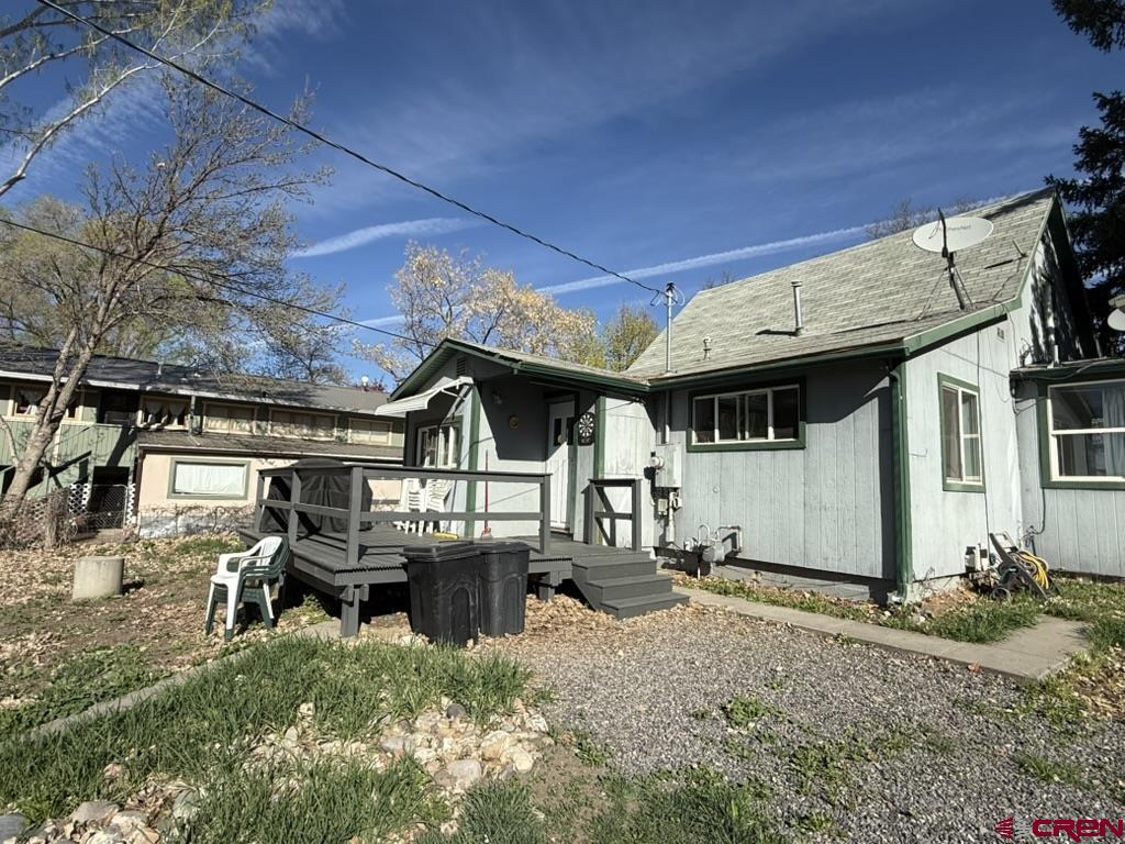 210 Southwest 6th Street Cedaredge, CO 81413 - Photo 2 of 16 a view of a house with backyard