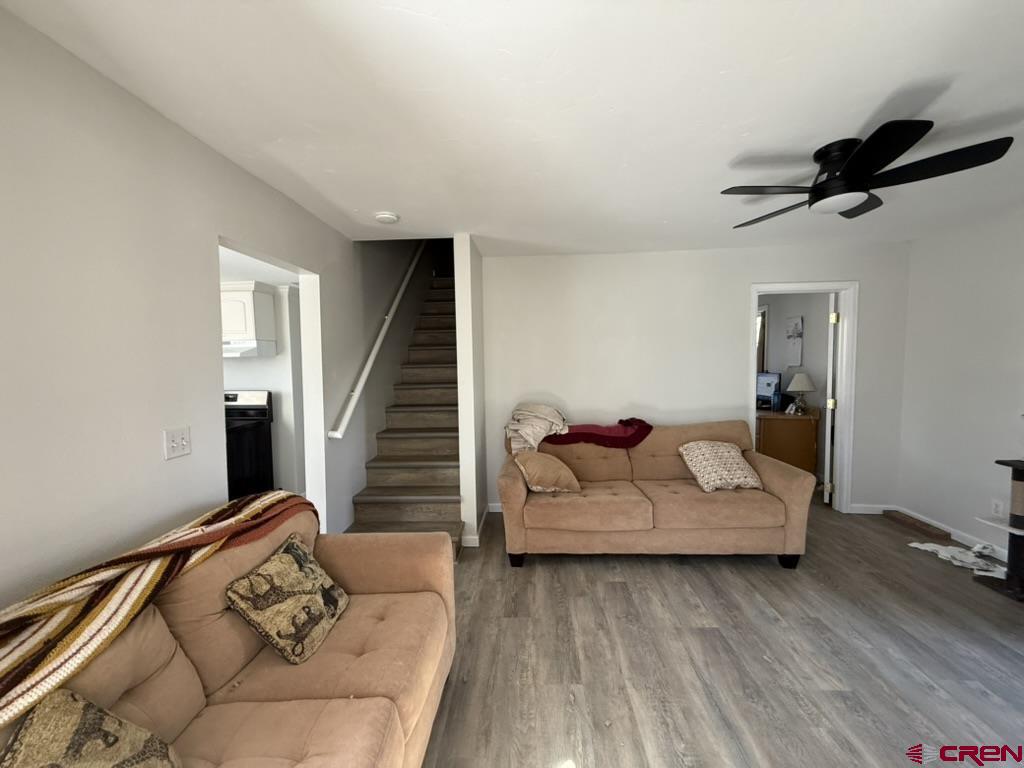 210 Southwest 6th Street Cedaredge, CO 81413 - Photo 3 of 16 a living room with furniture and stairs