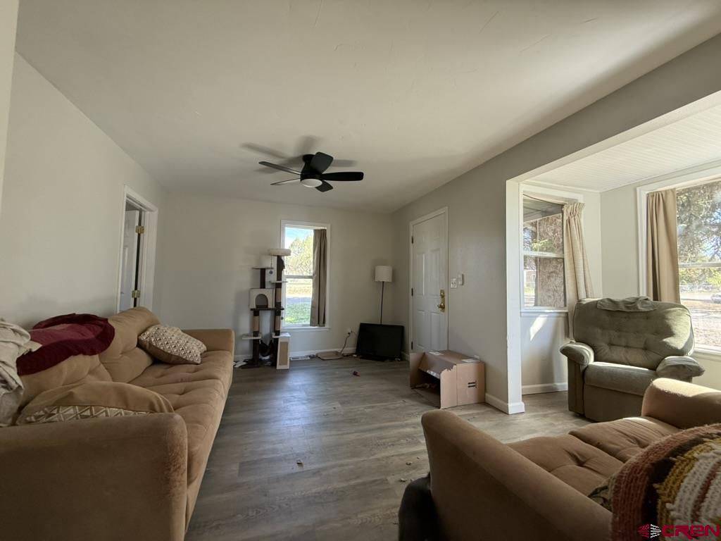 210 Southwest 6th Street Cedaredge, CO 81413 - Photo 4 of 16 a living room with furniture and wooden floor