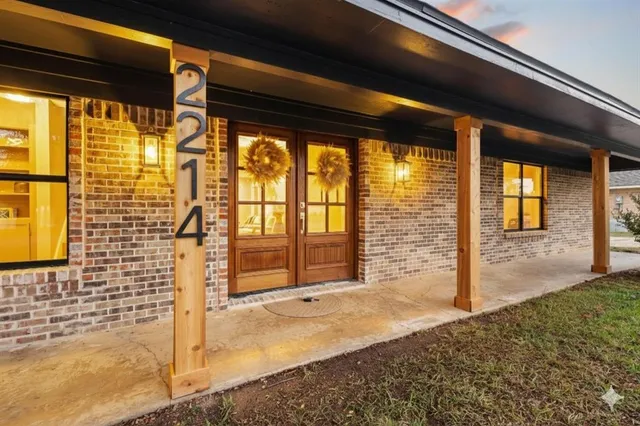 a front view of a house with a porch