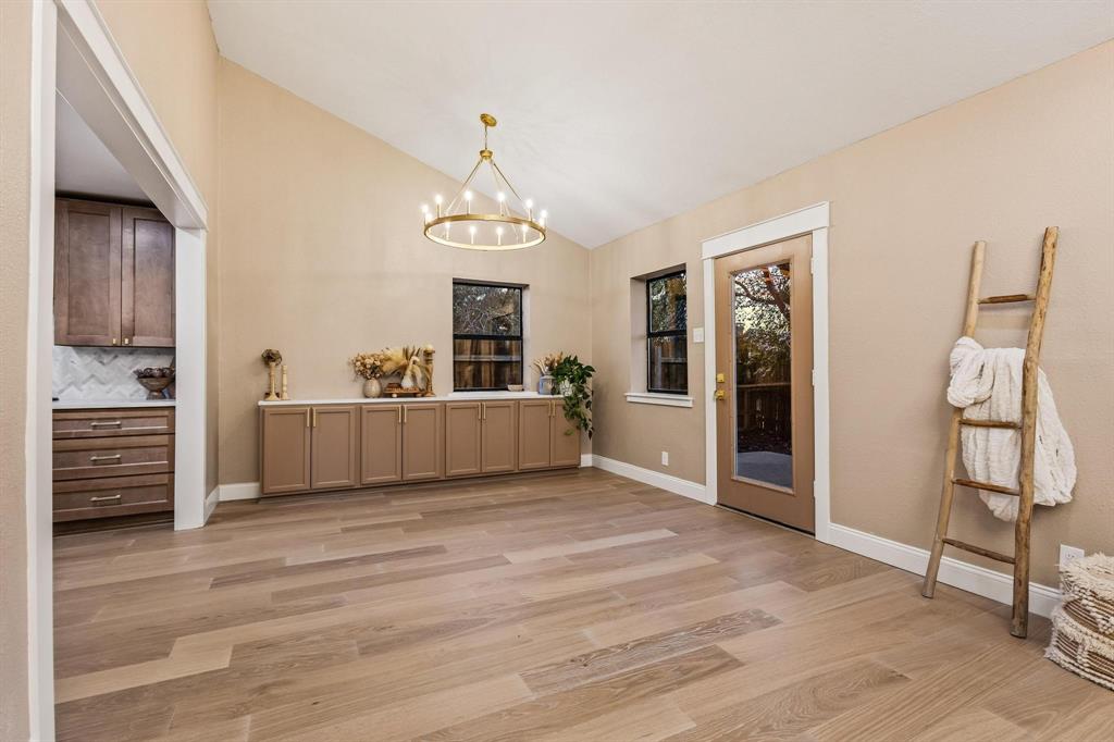 2214 Rex Cruse Drive Sherman, TX 75092 - Photo 13 of 40 a view of a kitchen with furniture and wooden floor