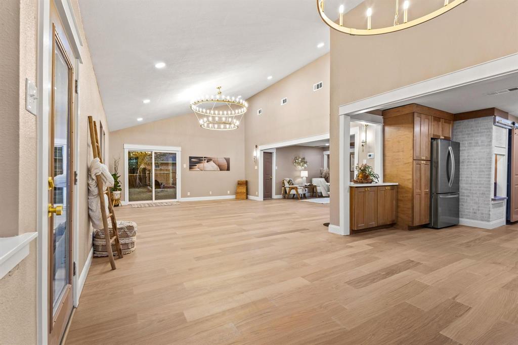 2214 Rex Cruse Drive Sherman, TX 75092 - Photo 15 of 40 a view of an empty room and kitchen with furniture and a window
