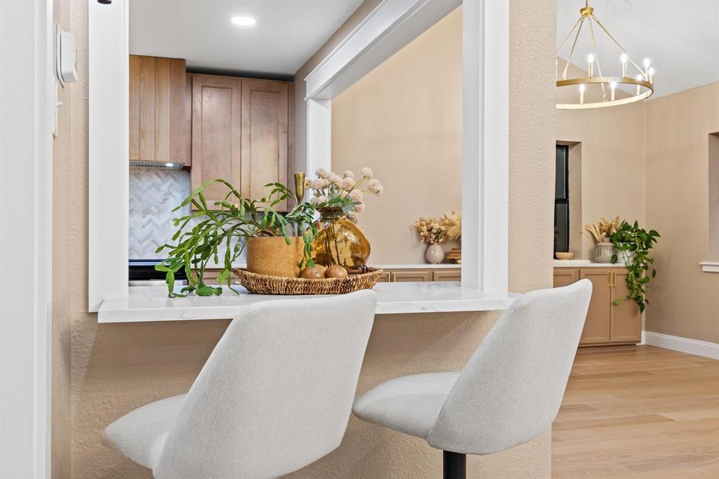 2214 Rex Cruse Drive Sherman, TX 75092 - Photo 16 of 40 a view of a dining room with furniture and a potted plant