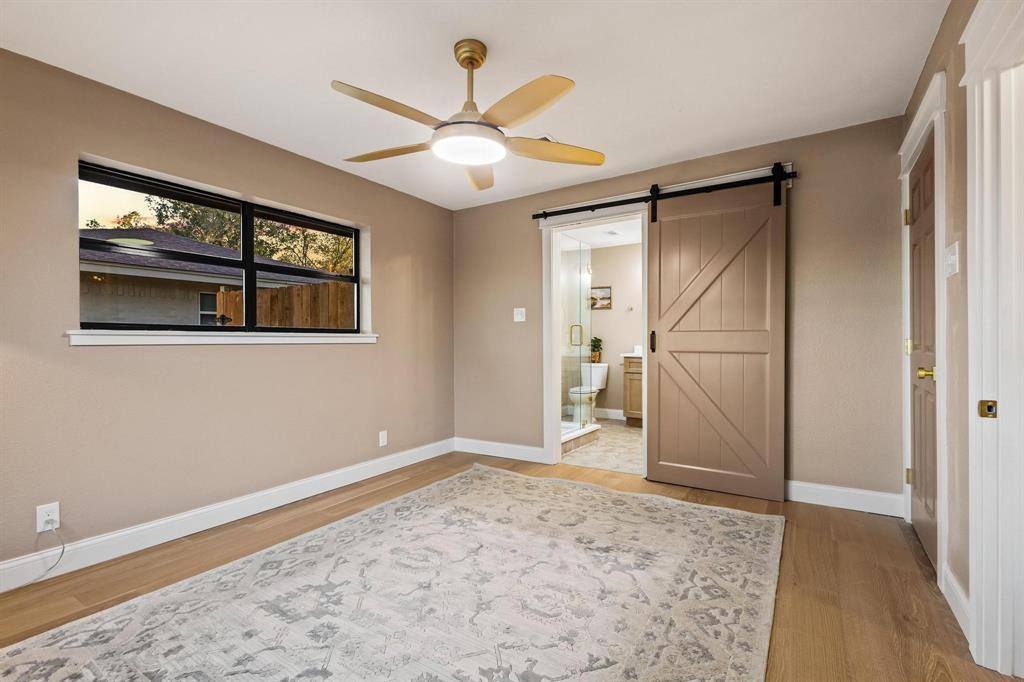 2214 Rex Cruse Drive Sherman, TX 75092 - Photo 22 of 40 a view of a livingroom with wooden floor and a ceiling fan