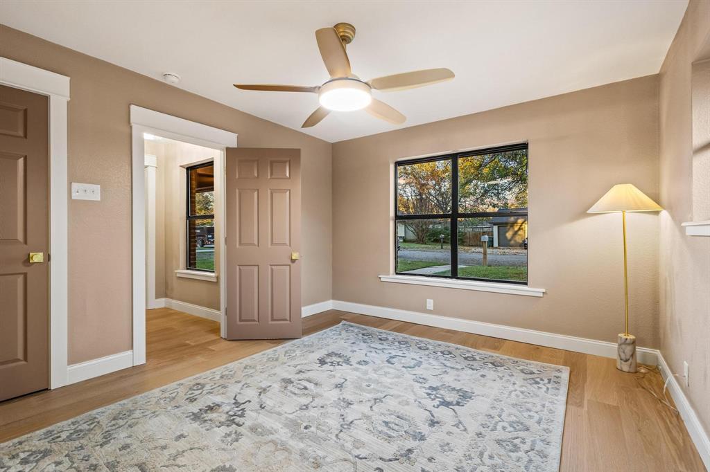 2214 Rex Cruse Drive Sherman, TX 75092 - Photo 24 of 40 a view of an empty room with window and wooden floor