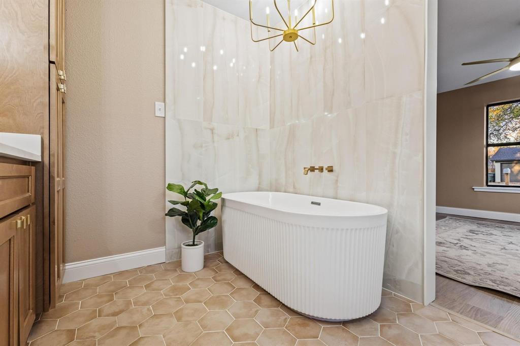 2214 Rex Cruse Drive Sherman, TX 75092 - Photo 26 of 40 a white bath tub sitting in a spacious bathroom