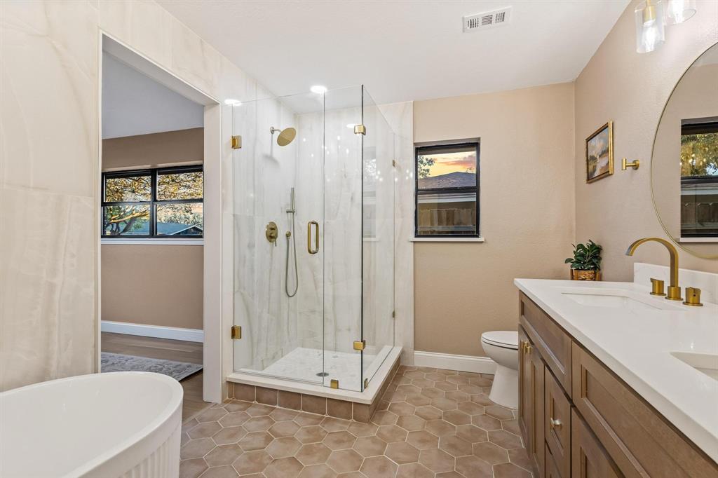 2214 Rex Cruse Drive Sherman, TX 75092 - Photo 27 of 40 a bathroom with a sink a toilet and shower