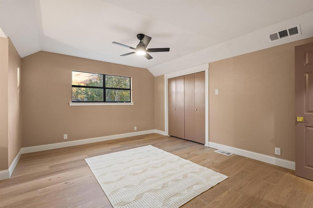 2214 Rex Cruse Drive Sherman, TX 75092 - Photo 30 of 40 a view of empty room with wooden floor and ceiling fan