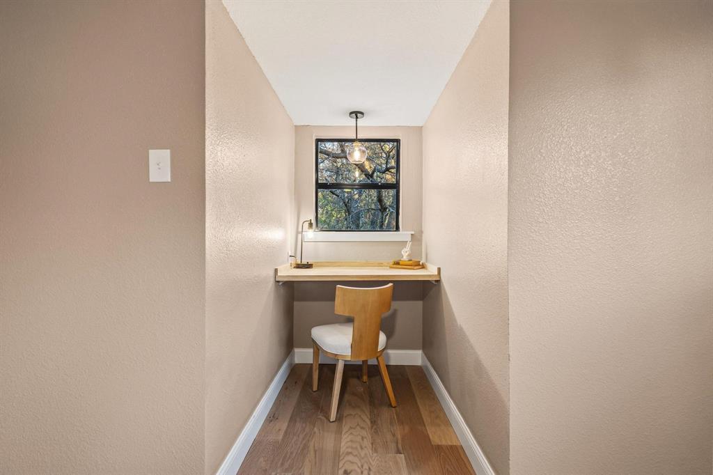 2214 Rex Cruse Drive Sherman, TX 75092 - Photo 32 of 40 a bench sitting in a room next to a window