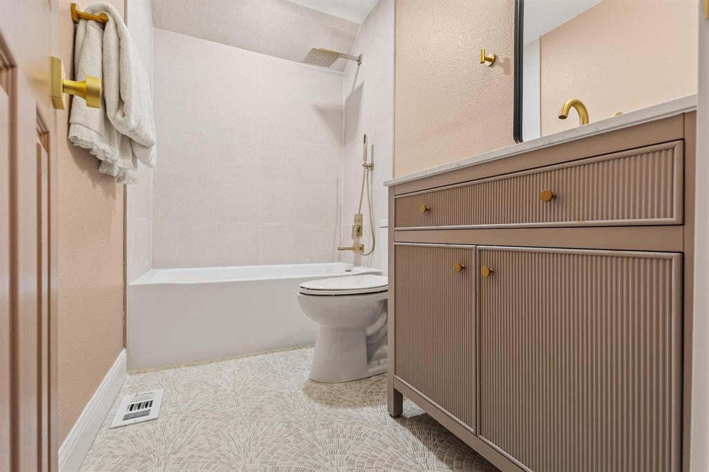 2214 Rex Cruse Drive Sherman, TX 75092 - Photo 34 of 40 a bathroom with a bathtub and a shower