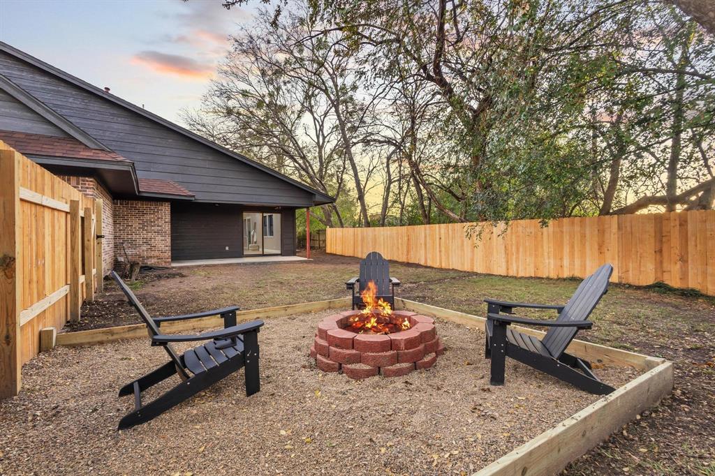 2214 Rex Cruse Drive Sherman, TX 75092 - Photo 39 of 40 a backyard of a house with table and chairs