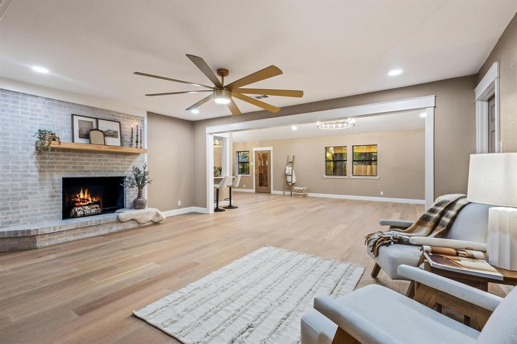 2214 Rex Cruse Drive Sherman, TX 75092 - Photo 9 of 40 a living room with furniture and a fireplace