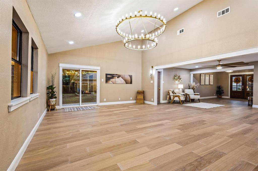 2214 Rex Cruse Drive Sherman, TX 75092 - Photo 10 of 40 a view of a room with gym equipment and chandelier