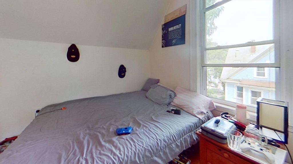 32 Gordon Street, Unit 3 Boston, MA 02134 - Photo 3 of 5 a bedroom with a bed and a window