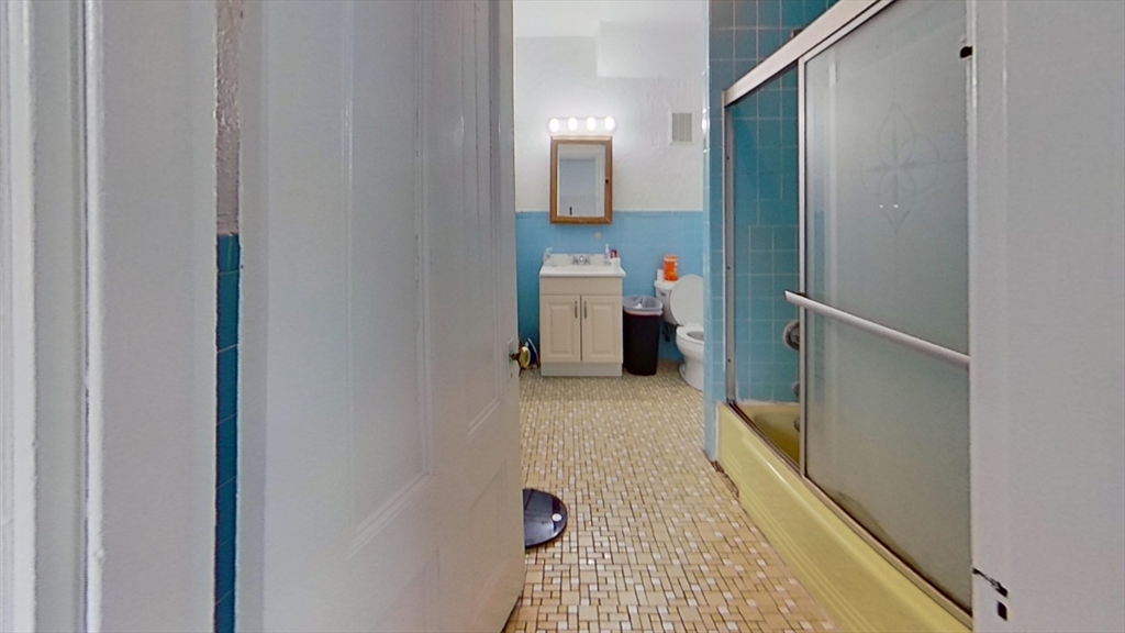 32 Gordon Street, Unit 3 Boston, MA 02134 - Photo 4 of 5 a bathroom with a sink and a mirror