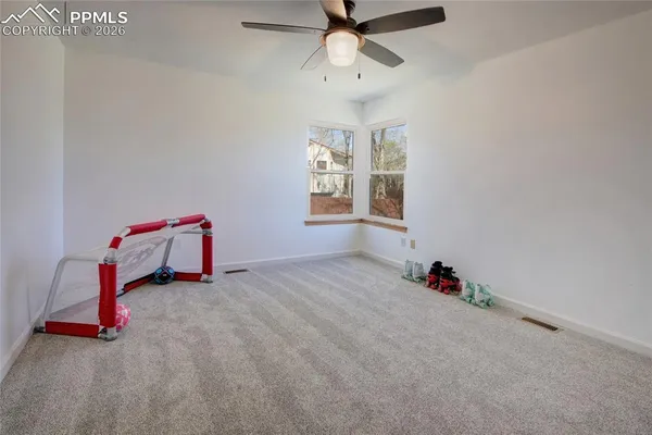 a view of room with window and workspace