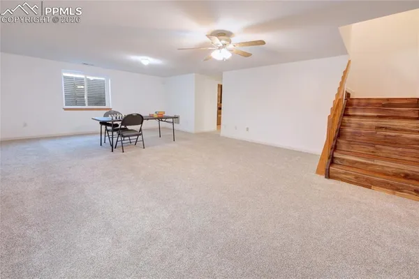 a view of livingroom with furniture and window