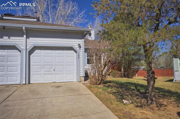 a house with trees in front of it