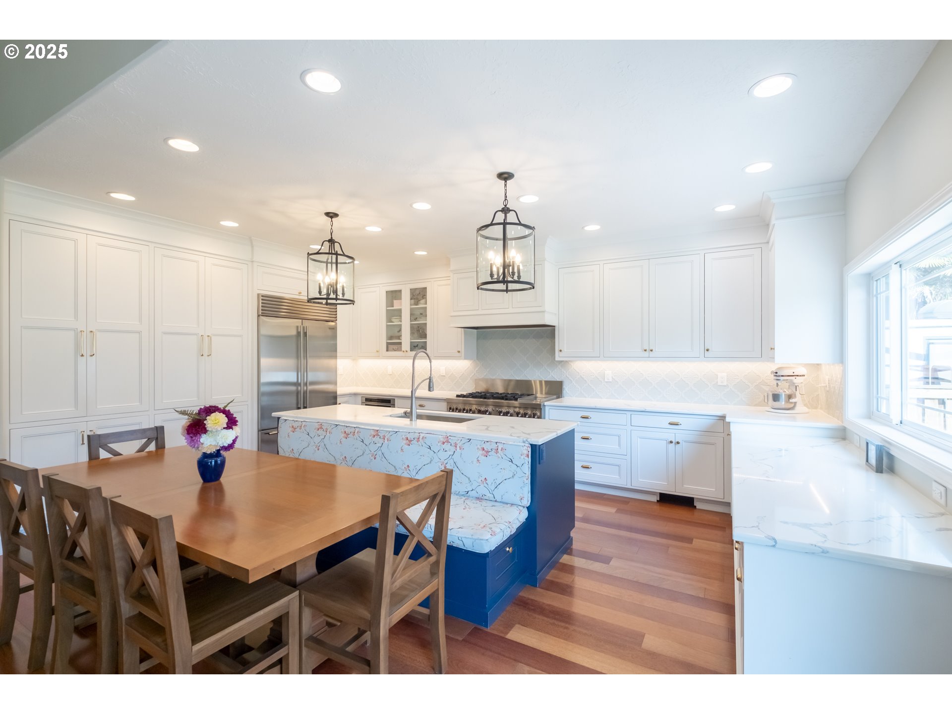 1435 Northwest Ashley Drive Albany, OR 97321 - Photo 11 of 44 a open kitchen with stainless steel appliances kitchen island a table chairs in it and white cabinets
