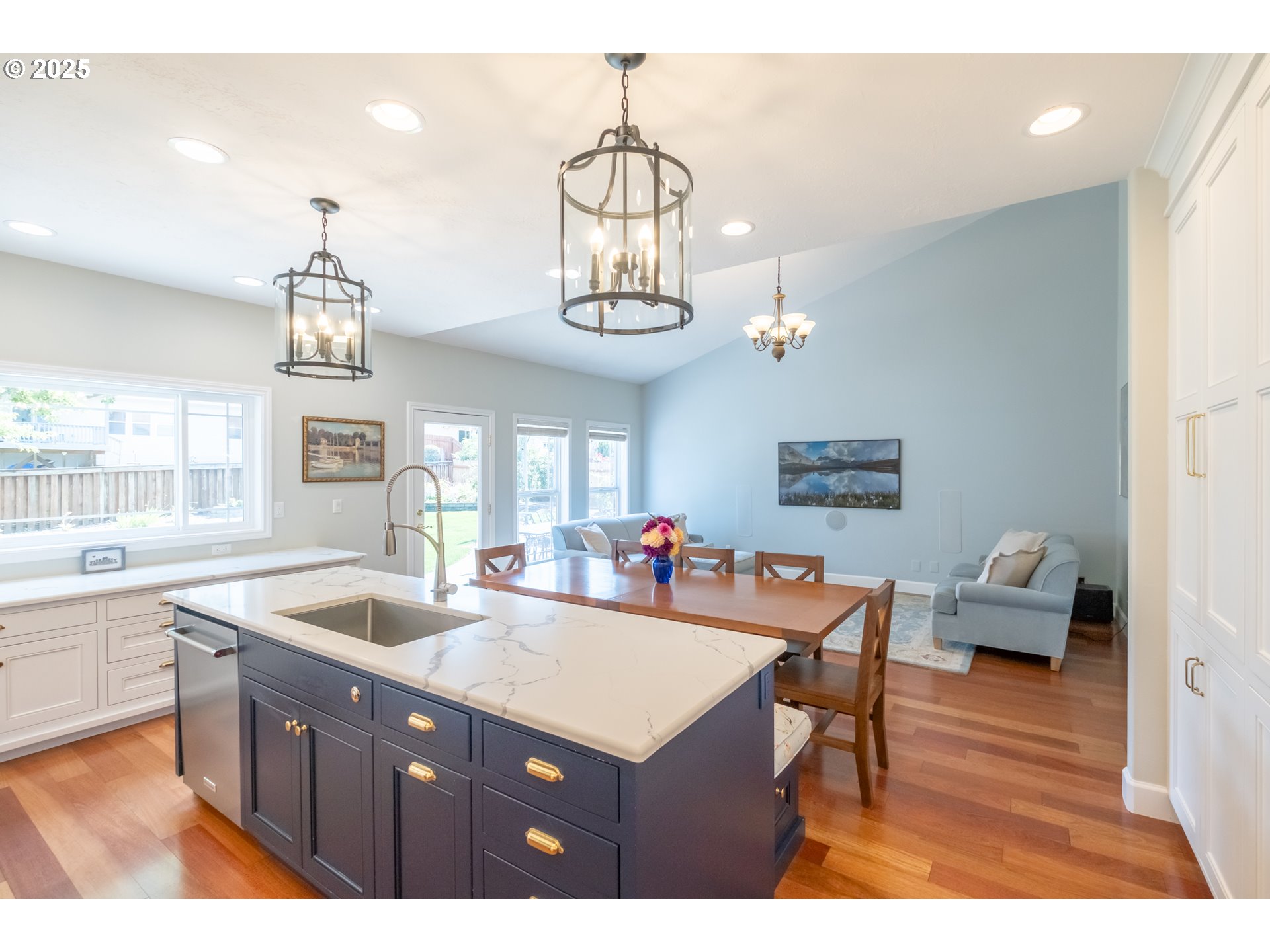 1435 Northwest Ashley Drive Albany, OR 97321 - Photo 12 of 44 a kitchen with a refrigerator a sink dishwasher a dining table and chairs with wooden floor